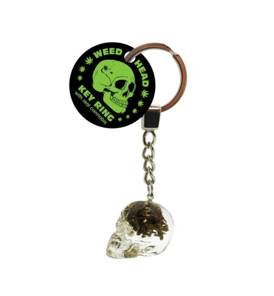 A skull shaped keychain with cannabis